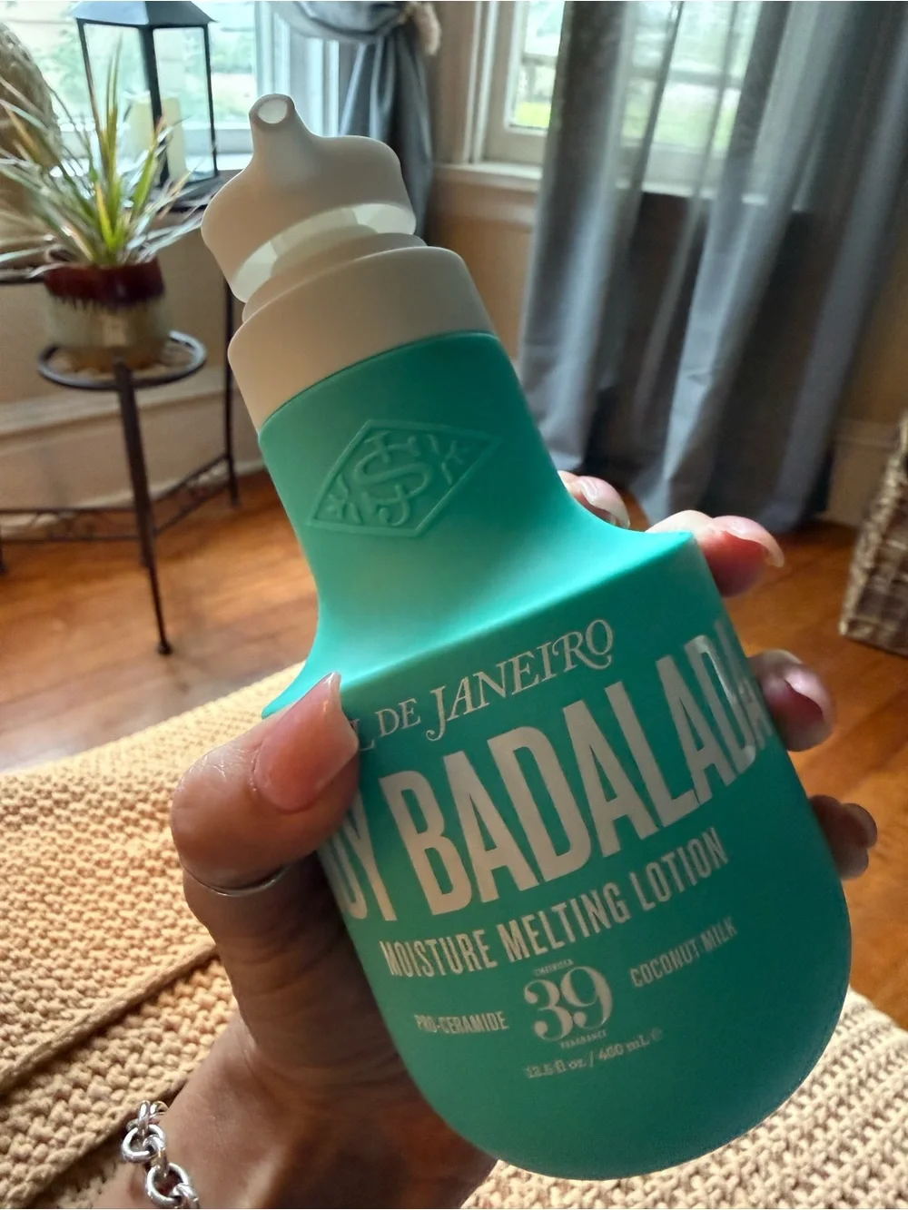 Sol de Janeiro Moisture Melting Lotion — Teal and White Bottle